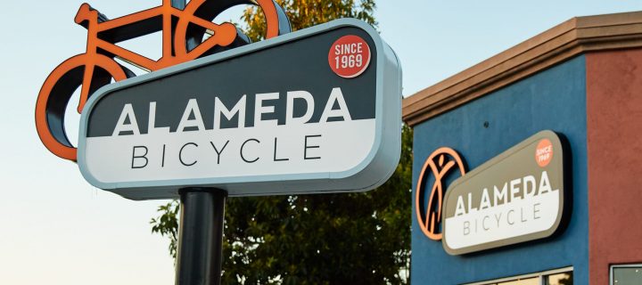 Ad Art Sign Co., AdArt, Full Service Signage, LED Lighting, Digital Signage,Retail, Face-lit double faced bike element on face it, with routed out and push-thru year indicator, pole sign, Alameda, CA,